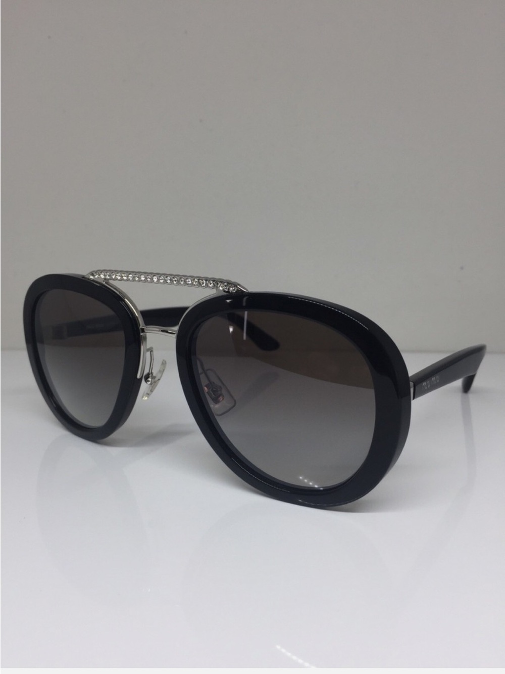 Miu Miu Black & Silver Frame Sunglasses with Grey Gradient Lenses